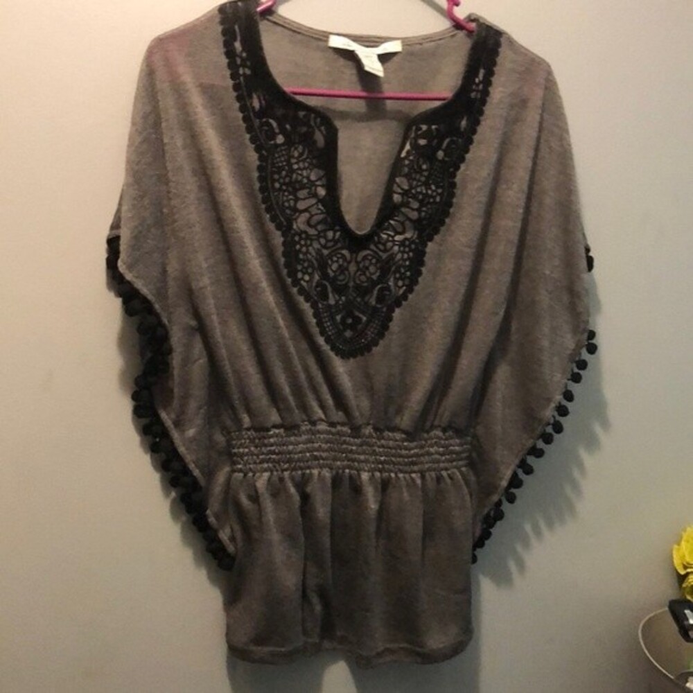 American rag size small grey with black Pom Poms batwing shirt